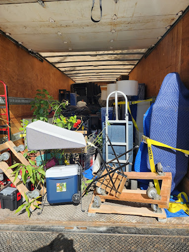 Professional movers carefully loading a truck